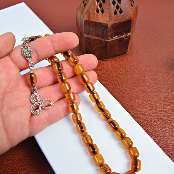 GÜMÜŞ KURTBAŞI VE ÜÇHİLAL PÜSKÜLLÜ SIKMA KEHRİBAR