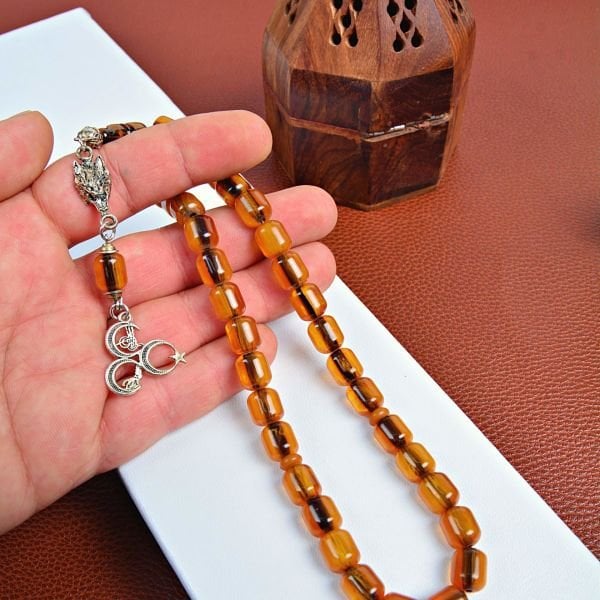 GÜMÜŞ KURTBAŞI VE ÜÇHİLAL PÜSKÜLLÜ SIKMA KEHRİBAR