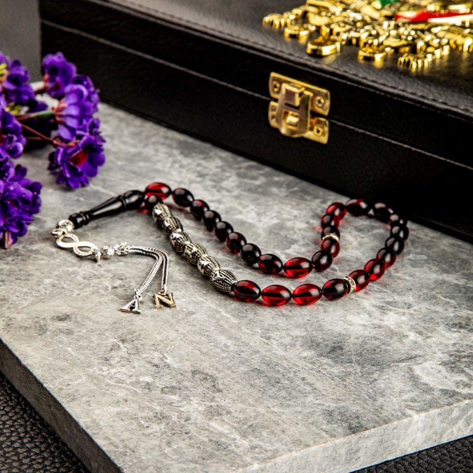 ATEŞ KEHRİBAR GÜMÜŞ PÜSKÜLLÜ TASARIM TESPİH