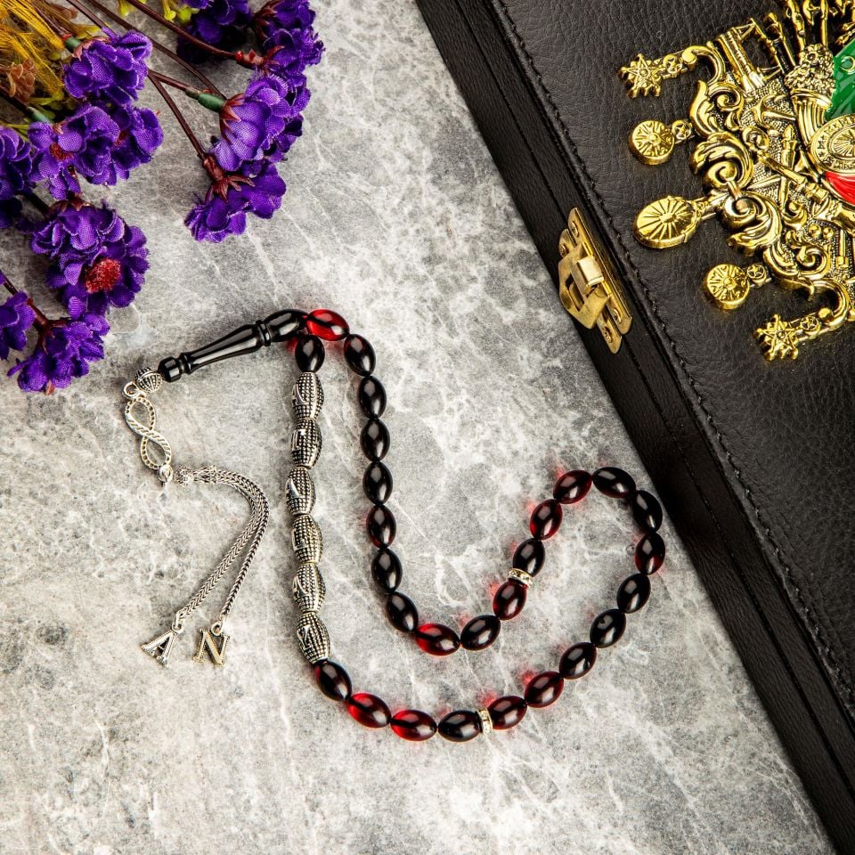 ATEŞ KEHRİBAR GÜMÜŞ PÜSKÜLLÜ TASARIM TESPİH