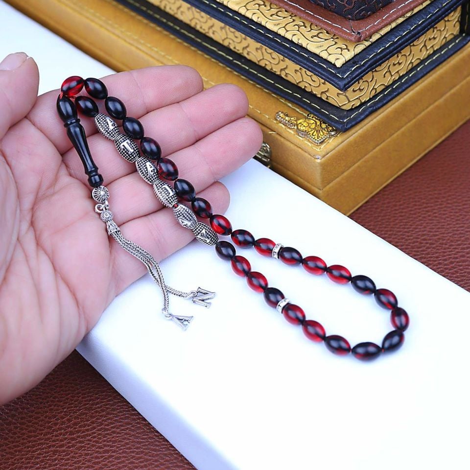 ATEŞ KEHRİBAR GÜMÜŞ PÜSKÜLLÜ TASARIM TESPİH